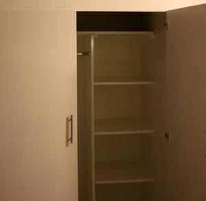 a closet with empty shelves in a room at Super Precio in Guatemala