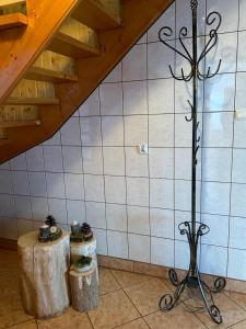 a metal pole in a room with two tables at Murań in Czarna Góra