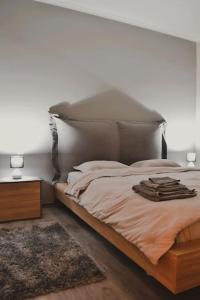 a bedroom with a large bed with a headboard at Stelios apartment in Kastoria