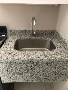 a kitchen sink with a granite counter top at Bay Heights Escape in Gros Islet