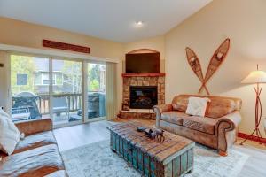 a living room with a couch and a fireplace at New Luxury Pond Villa #558 Hot Tub & Views - 500 Dollars Of FREE Activities & Equipment Rentals Daily in Winter Park