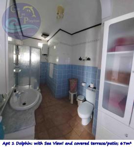 a blue tiled bathroom with a toilet and a sink at CASA LAS PLAYITAS -CLP- BEST SEA VIEW - In 1 Minute Ocean in Las Playitas