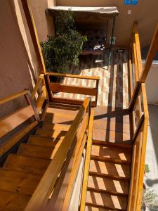 a group of wooden stairs next to a building at Hostal doña irene in Vicuña