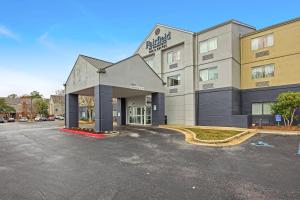 a hotel with a parking lot in front of it at Fairfield Inn and Suites Mobile in Mobile