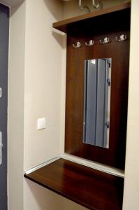 a bathroom with a mirror on a wooden shelf at Marina Boszkowo in Boszkowo-Letnisko