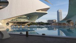 a building with a reflection in a body of water at Lyesblb in Valencia