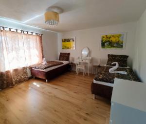a living room with a bed and a couch at Ferienhaus del Pueblo in Bechtsrieth +27 photos