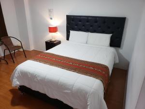 Postel nebo postele na pokoji v ubytování Cusco de mis Sueños Hostal - II