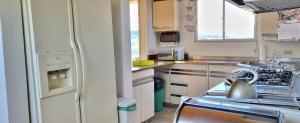a kitchen with a sink and a stove at Mágica CASA FINCA represa del Sisga wi-fi, tv, BBQ in Chocontá +19 photos