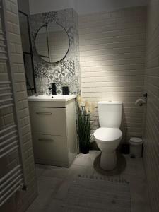 Kylpyhuone majoituspaikassa ROMAN Residence Apartment