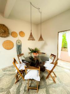 a dining room with a table and chairs at Casa da Cosmira in Trancoso +38 photos