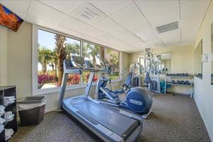 a gym with two tread machines and a treadmill at Islander 311 Sandy Dunes in Destin