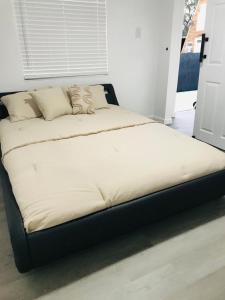 a large bed sitting in a room with at 10515 Houston Avenue in Hudson