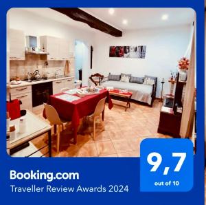 a kitchen and a living room with a table and chairs at La casa del Borgo Anagni in Anagni +70 photos