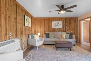 a living room with a couch and a ceiling fan at Mountain View Gem BHBungalows #2 in Custer