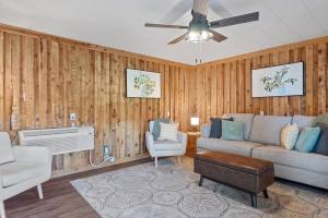 a living room with a couch and a fan at Mountain View Gem BHBungalows #2 in Custer