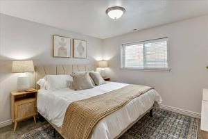 a bedroom with a large bed and a window at King Suite Large Backyard Lots of Parking in Springville