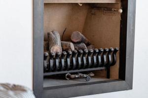 a mirror with a pile of objects in a room at Apartment on Belgian Coast with Sea View in De Haan