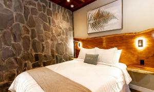 Postel nebo postele na pokoji v ubytování Hotel Boutique Los Abetos