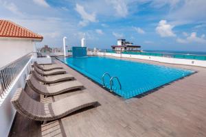 a swimming pool on the roof of a building at Supun Arcade Residency in Colombo