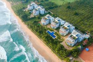 an aerial view of a resort on the beach at Oceanfront condo 3-2-01- Nilaveli in Nilaveli