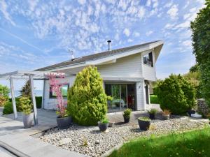 a house with plants in the front yard at Maison Lugrin, 5 pièces, 7 personnes - FR-1-498-97 in Lugrin