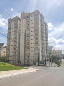 a large apartment building on the side of a street at Cond. Mont Blanc Apto. 616 in Caldas Novas