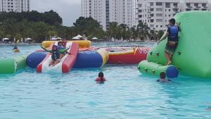 a group of people in the water at a water park at MM VILLA in Panama City
