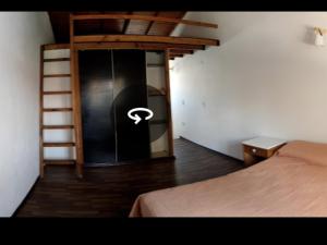a bedroom with a bunk bed and a ladder at Hermoso Duplex familiar en Zona Norte in Mar del Plata