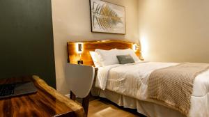 Postel nebo postele na pokoji v ubytování Hotel Boutique Los Abetos
