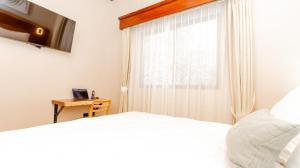 Postel nebo postele na pokoji v ubytování Hotel Boutique Los Abetos