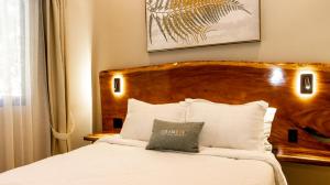 Postel nebo postele na pokoji v ubytování Hotel Boutique Los Abetos