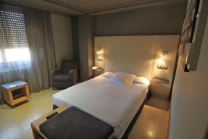 Posteľ alebo postele v izbe v ubytovaní Hotel Almirante