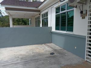 a fence in front of a house at Teratak Homestay in Changlun