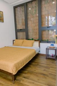 Ein Bett oder Betten in einem Zimmer der Unterkunft Boom Casa Homestay