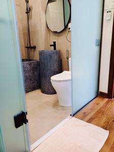 Ein Badezimmer in der Unterkunft Boom Casa Homestay