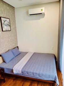 Ein Bett oder Betten in einem Zimmer der Unterkunft Boom Casa Homestay