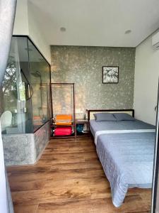 Ein Bett oder Betten in einem Zimmer der Unterkunft Boom Casa Homestay