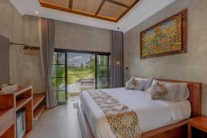 Giường trong phòng chung tại VILLARIZ Ubud , Bali