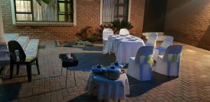 a group of tables and chairs in a courtyard at Molata Rabs in Polokwane