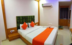 HOTEL GREEEN LEAF客房内的一张或多张床位