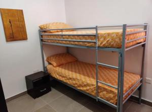 a couple of bunk beds in a room at 4 bedroom apt 5 mins away from beach and amenities in St Paul's Bay +1 photo