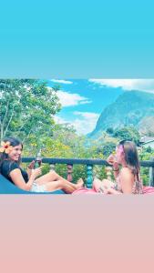 a group of women sitting on a roller coaster at Rock View Hostel Ella in Ella