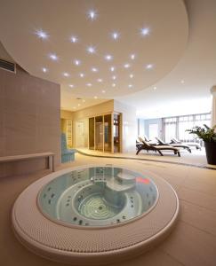 a large room with a large bowl in the middle of a building at Hotel Green in Dolný Kubín