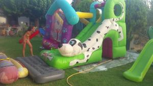 a child is playing on a inflatable play set at House on the beach in Niforeika