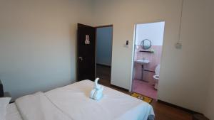 Letto o letti in una camera di DONG’HOME东东小院
