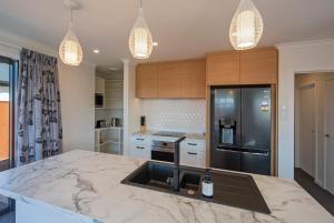 a kitchen with a marble counter top and a sink at The Shepherds Retreat in Richmond