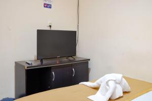 Postel nebo postele na pokoji v ubytování Dya Hotel Boyolali