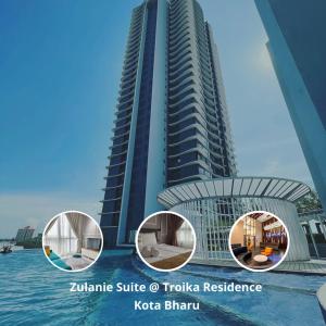 een weergave van een hoog gebouw naast het water bij Zulanie Suite Troika Residence, SPACIOUS AND COZY WITH POOL, Free Wifi & Netflix in Golden Triangle of Kota Bharu in Kota Bharu