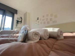 Łóżko lub łóżka w pokoju w obiekcie VILLA FENIX MILANO